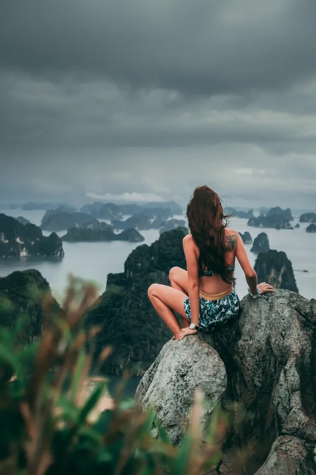 Traveler overlooking island mountains